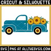 side view of vintage truck with 3 sunflowers in bed of truck